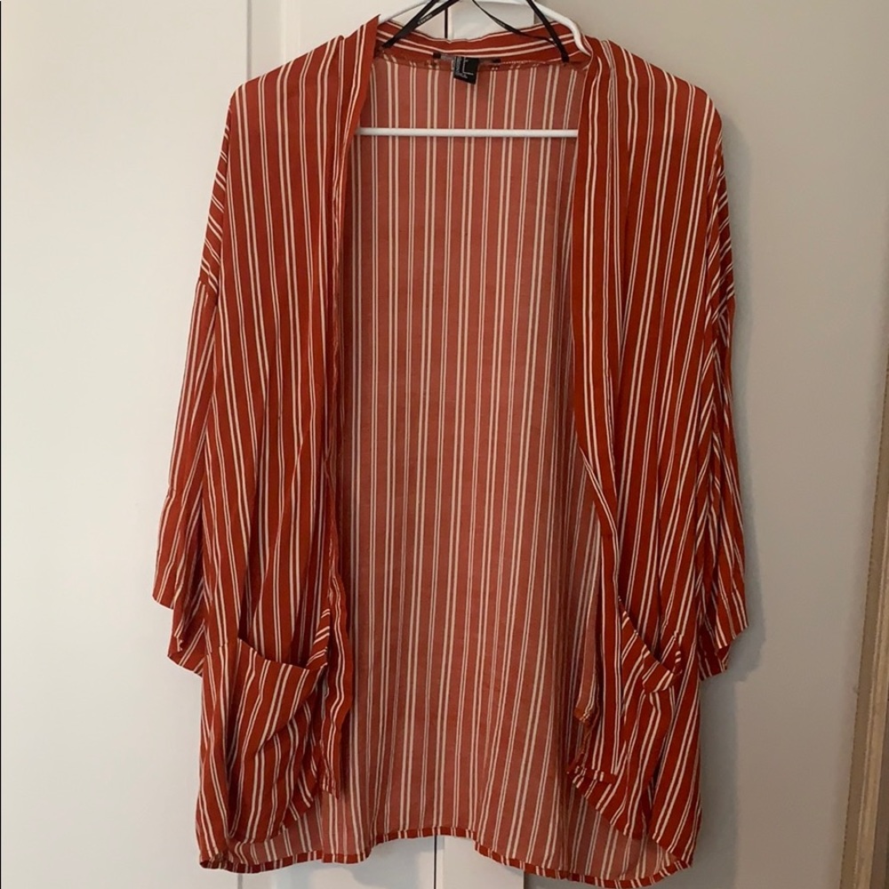 Dark orange and white stripped open blouse.